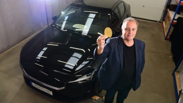 Auto Express editor-in-chief Steve Fowler holding a speaker developed by Warwick Acoustics